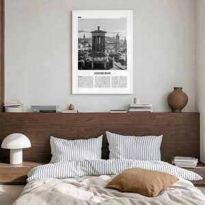 Edinburgh Poster, black and white monument photo print in a white wood frame, hanging in a bedroom