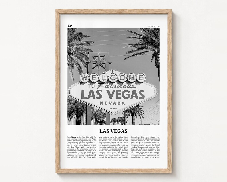 Las Vegas black and white poster print in a natural wood frame on a wall