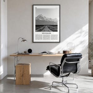New Zealand Poster, black and white photo print in a black wood frame, hanging in a bright home office