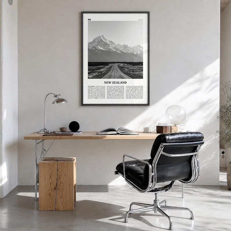 New Zealand Poster, black and white photo print in a black wood frame, hanging in a bright home office