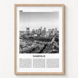 Nashville black and white poster print in a natural wood frame on a wall