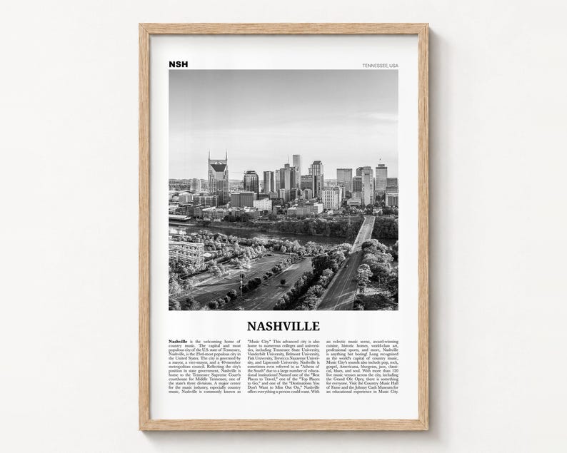 Nashville black and white poster print in a natural wood frame on a wall