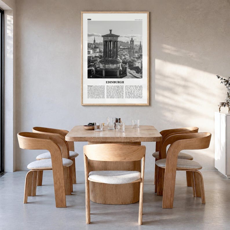 Edinburgh Poster, black and white monument photo print in a natural wood frame, hanging in a dining room