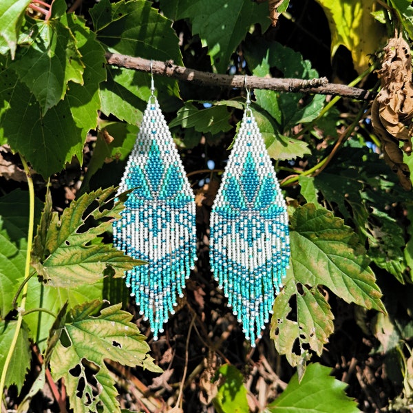 Turquoise lotus flower on white beaded earrings Aesthetic Fringe Bohemian Artisan Unique jewelry Exclusive Slow fashion Colorful