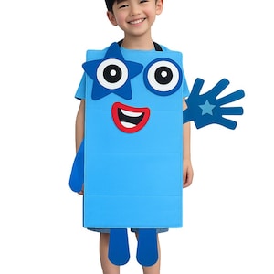 May include: A bright blue rectangular costume featuring a cartoon face with a star-shaped eye, a circular eye, and a red mouth. The costume includes a blue hand-shaped attachment and a black headband with a blue square displaying the number 5.