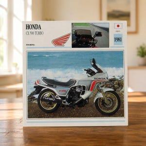 May include: A square print featuring a 1981 Honda CX 500 Turbo motorcycle. The design includes the text Honda CX 500 Turbo, a red wing logo, a small inset photo of the motorcycle on a road, the year 1981, and a Japanese flag icon.
