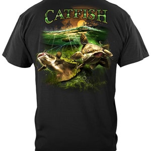May include: Black t-shirt with a graphic print of two catfish swimming in a green and blue underwater scene. The text "CATFISH" is printed in green above the fish.