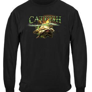 May include: Black long-sleeve t-shirt with a graphic of a catfish jumping out of the water with the word "CATFISH" above it.