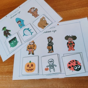 May include: Printable Halloween dress up game with images of a shark, a bear, a pumpkin, a skeleton, a ladybug, a monster, a ghost, a witch, and a gingerbread man. The game includes the text "Halloween dress up" and "Ween dress up".