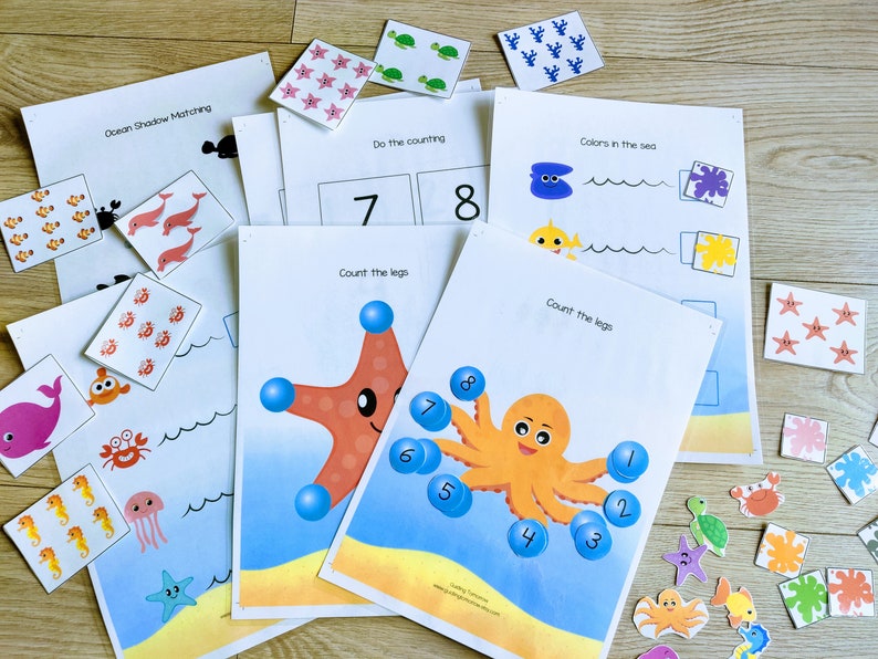 Puede incluir: Un conjunto de hojas de trabajo educativas imprimibles con tem&aacute;tica oce&aacute;nica para ni&ntilde;os. Las hojas de trabajo incluyen actividades de conteo, coincidencia de sombras e identificaci&oacute;n de colores. Las hojas de trabajo incluyen im&aacute;genes de criaturas marinas como estrellas de mar, pulpos, medusas y caballitos de mar.