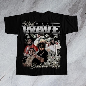 May include: Black t-shirt with a vintage-style graphic of a group of men with the text "Rod Wave Believe Me" printed on the front.