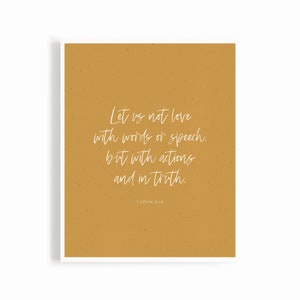 May include: A mustard yellow background with white text that reads "Let us not love with words or speech, but with actions and in truth. 1 John 3:18".