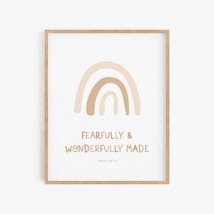 May include: A beige and brown rainbow with the text "Fearfully & Wonderfully Made" and "Psalm 139:14" below it.