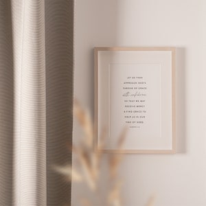 May include: A framed print with a white background and black text. The text reads: "Let us then approach God's throne of grace with confidence so that we may receive mercy & find grace to help us in our time of need. Hebrews 4:16"