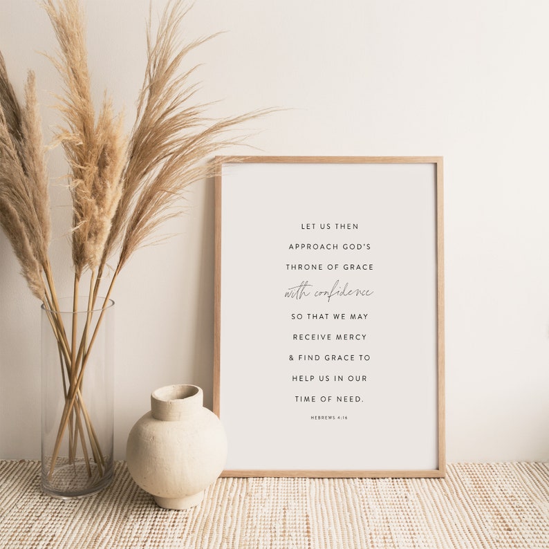 May include: A framed print with a white background and black text. The text reads "Let us then approach God's throne of grace with confidence so that we may receive mercy & find grace to help us in our time of need. Hebrews 4:16".