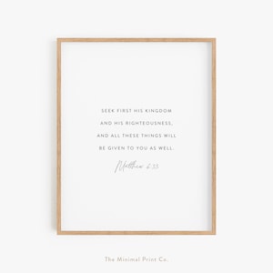 May include: A printable wall art design with a white background and black text. The text reads "Seek first his kingdom and his righteousness, and all these things will be given to you as well. Matthew 6:33". The text is in a simple, modern font. The image also includes the text "The Minimal Print Co."