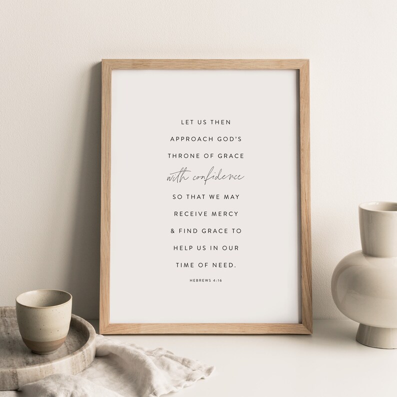 May include: A framed print with a white background and black text. The text reads: "Let us then approach God's throne of grace with confidence so that we may receive mercy & find grace to help us in our time of need. Hebrews 4:16"