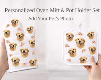 May include: White oven mitt and pot holder set featuring a repeating pattern of a Golden Retriever's face and pizza slices. The text "Personalized Oven Mitt & Pot Holder Set Add Your Pet's Photo" is displayed above the items.
