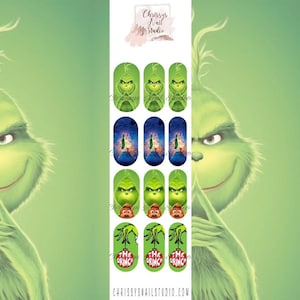 May include: Green nail art decals featuring the Grinch character in various designs. The designs include the Grinch's face, scenes from the movie, and the text "The Grinch". The background is a light green gradient.