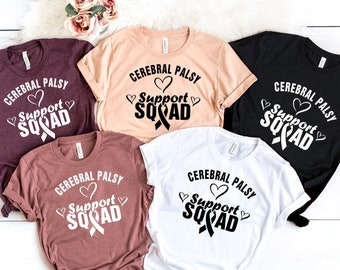 May include: Five t-shirts in different colours with the text "Cerebral Palsy Support Squad" and a black ribbon with a heart on each shirt.