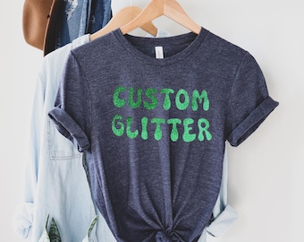カスタムグリッターTシャツ、パーソナライズグリッターTシャツ、カスタムグリッターTシャツ、カスタムグリッターテキスト、キラキラTシャツ、クリスマスグリッターTシャツ、