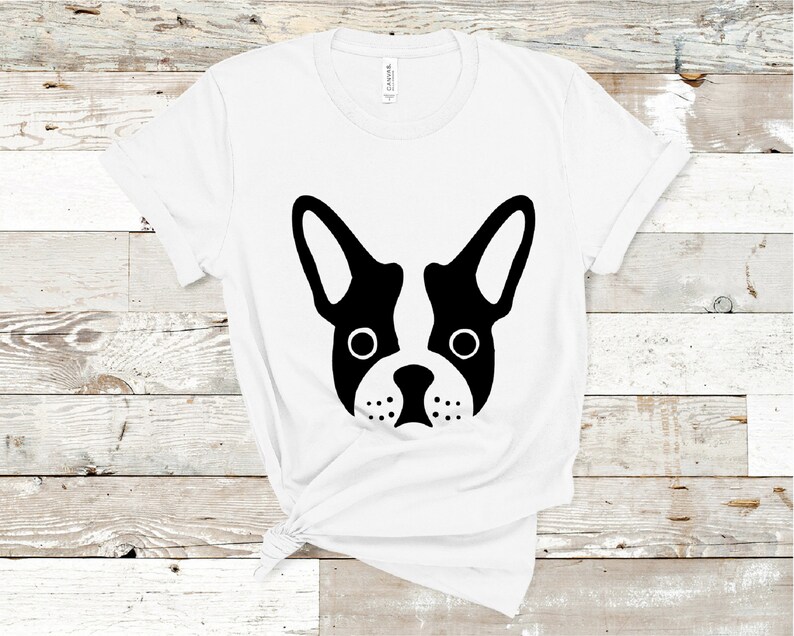 May include: White t-shirt with a black and white silhouette of a French bulldog's face.
