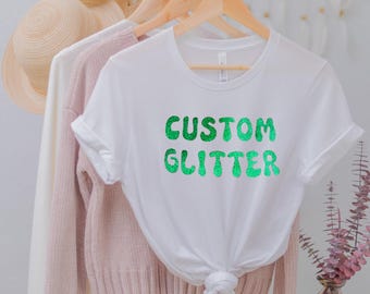 カスタムグリッターTシャツ、パーソナライズグリッターTシャツ、カスタムグリッターTシャツ、カスタムグリッターテキスト、キラキラTシャツ、クリスマスグリッターTシャツ、