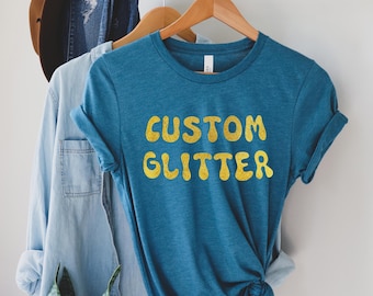 カスタムグリッターTシャツ、パーソナライズグリッターTシャツ、カスタムグリッターTシャツ、カスタムグリッターテキスト、キラキラTシャツ、クリスマスグリッターTシャツ、