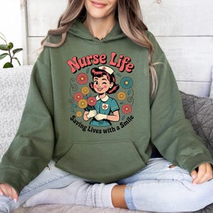 Nurse Life Hoodie with Smile and Flowers, Retro Cartoon Medical Pullover Gift for Cheerful Professionals