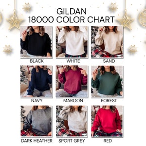 May include: A color chart displays Gildan 18000 sweatshirts in various colors. The colors include black, white, sand, navy, maroon, forest green, dark heather grey, sport grey, and red. Each sweatshirt is shown on a person.