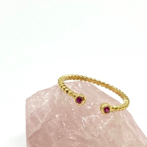 Open design 18k solid gold ring with two mineral round-shaped rubies. July&#39;s birthstone ring, a stylish dot ring bringing purity & passion.
