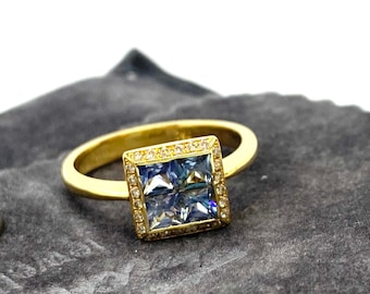 Square princess cut sapphires with white diamonds outline on a 18k solid gold ring. Brilliant engagement ring, anniversary glorious gift.