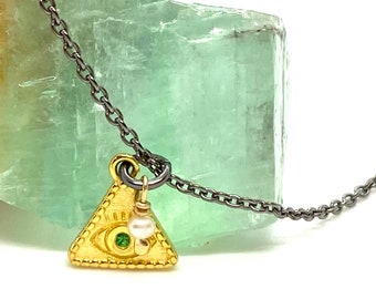 14k gold triangular eye pendant set in a long silver chain. Bohemian chic necklace made in Greece.