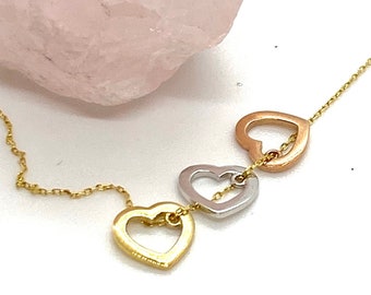 Three 14k golden hearts fine necklace. White, rose and yellow love charms set in a 14k yellow gold chain. Valentine's jewelry gift for her.