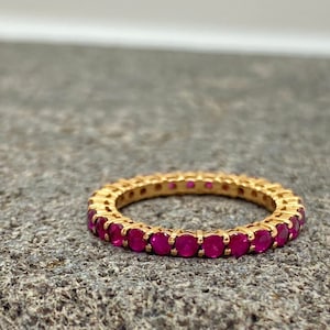 18k rose gold band fully encrusted with twenty seven mineral rubies. Anniversary birthday fine ring made in MELIGreece&#39;s workshop in Athens.