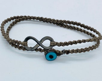 Male silver eternity symbol, black rhodium plated tied on a khaki bracelet fasten with a turquoise enamelled clasp. Birthday gift for him.