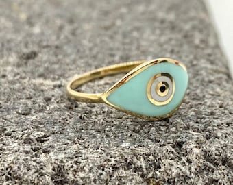 14k yellow gold ring with enamel eye design. Elegant light blue smalti on a solid gold band with protective properties, summer jewelry gift.