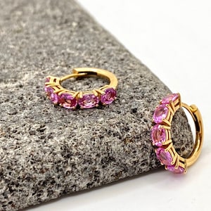 Ten oval-shaped baby pink sapphires, set in 18k solid gold hoops.Fine hoop earrings, unique jewelry gift for good fortune & intense passion.