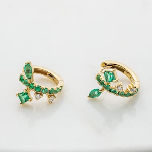 Emerald and diamonds 18k gold small hoops. Fashionable vivid green gemstone diamond gold earrings expressing rebirth and love.