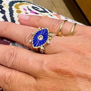 Lapis lazuli eye shaped grand ring with white and brown diamonds. September&#39;s birhtday gift custom made in MELIGreece&#39;s workshop in Athens.