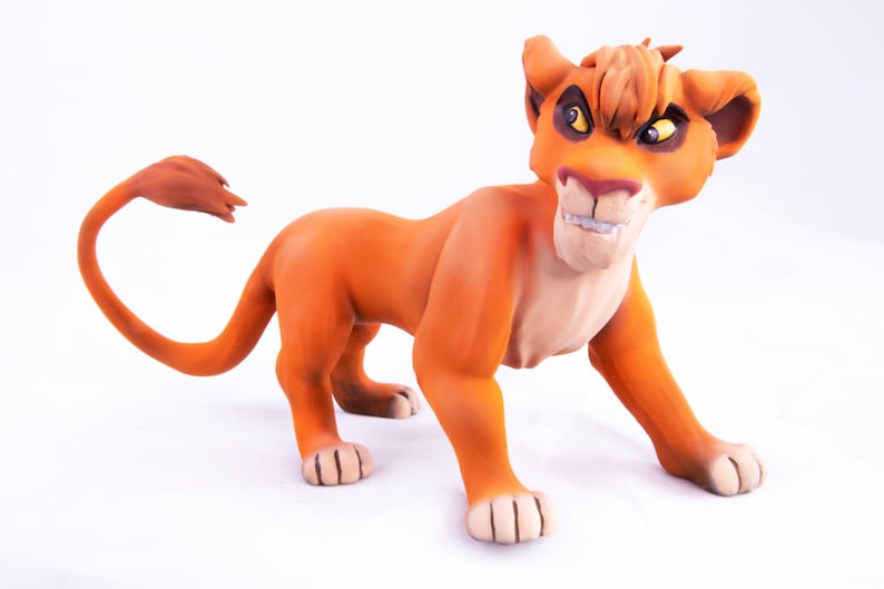 May include: A hand-painted orange and brown lion figurine with a fierce expression. The figurine is made of a smooth, textured material and has a long tail.