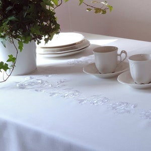 Ready to ship. The tablecloth is covered with a waterproof coating WILD ROSE White embroidered tablecloth with pastel pink wild roses