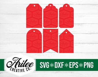 May include: Set of six red gift tags with a geometric pattern and the text "Arilee Creative Co." repeated throughout. The tags are in various shapes, including rectangular, rounded rectangular, and banner shapes.