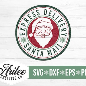 May include: A green and red circular design with the text "Express Delivery Santa Mail" and a cartoon image of Santa Claus's face. The design is on a white wood background. The text "Arilee Creative Co." is in the lower left corner and the text "SVG DXF EPS PNG" is in the lower right corner.