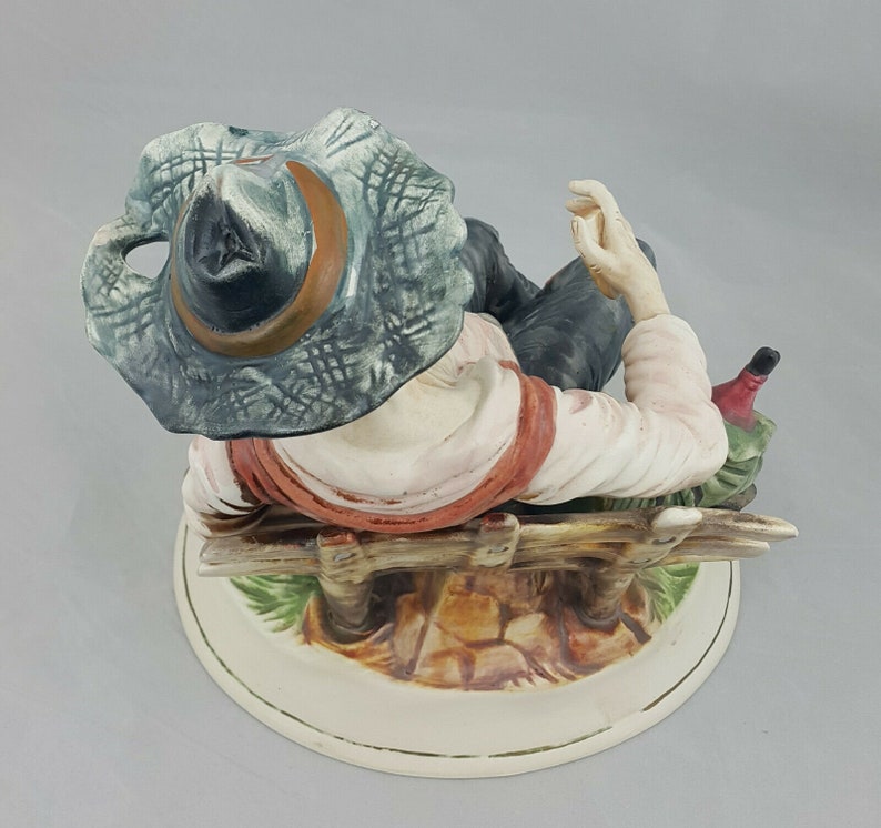 capodimonte tramp on bench with dog