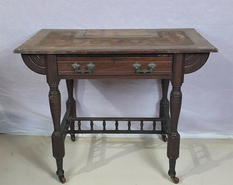 An Edwardian Oak Writing Table - Fitted with a Drawer
