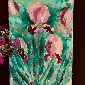 May include: A painting of pink flowers with green leaves on a white canvas. The flowers are painted in a loose, impressionistic style.