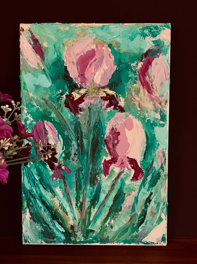 May include: A painting of pink flowers with green leaves on a white canvas. The flowers are painted in a loose, impressionistic style.