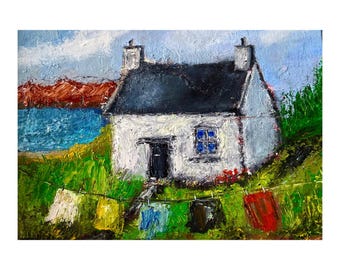 May include: Impressionistic painting of a white cottage with a dark roof, blue window, and black door. A clothesline with colorful laundry hangs in front of the cottage. The background features a blue sea, red cliffs, and a blue sky.