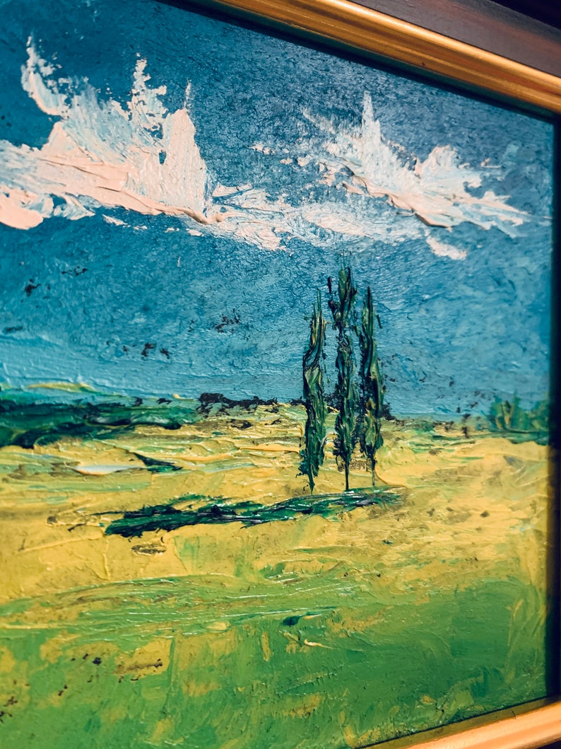 May include: A painting of a landscape with three trees in the foreground and a blue sky with white clouds in the background. The trees are painted in a green and brown color, and the sky is painted in a light blue color. The clouds are painted in a white color.